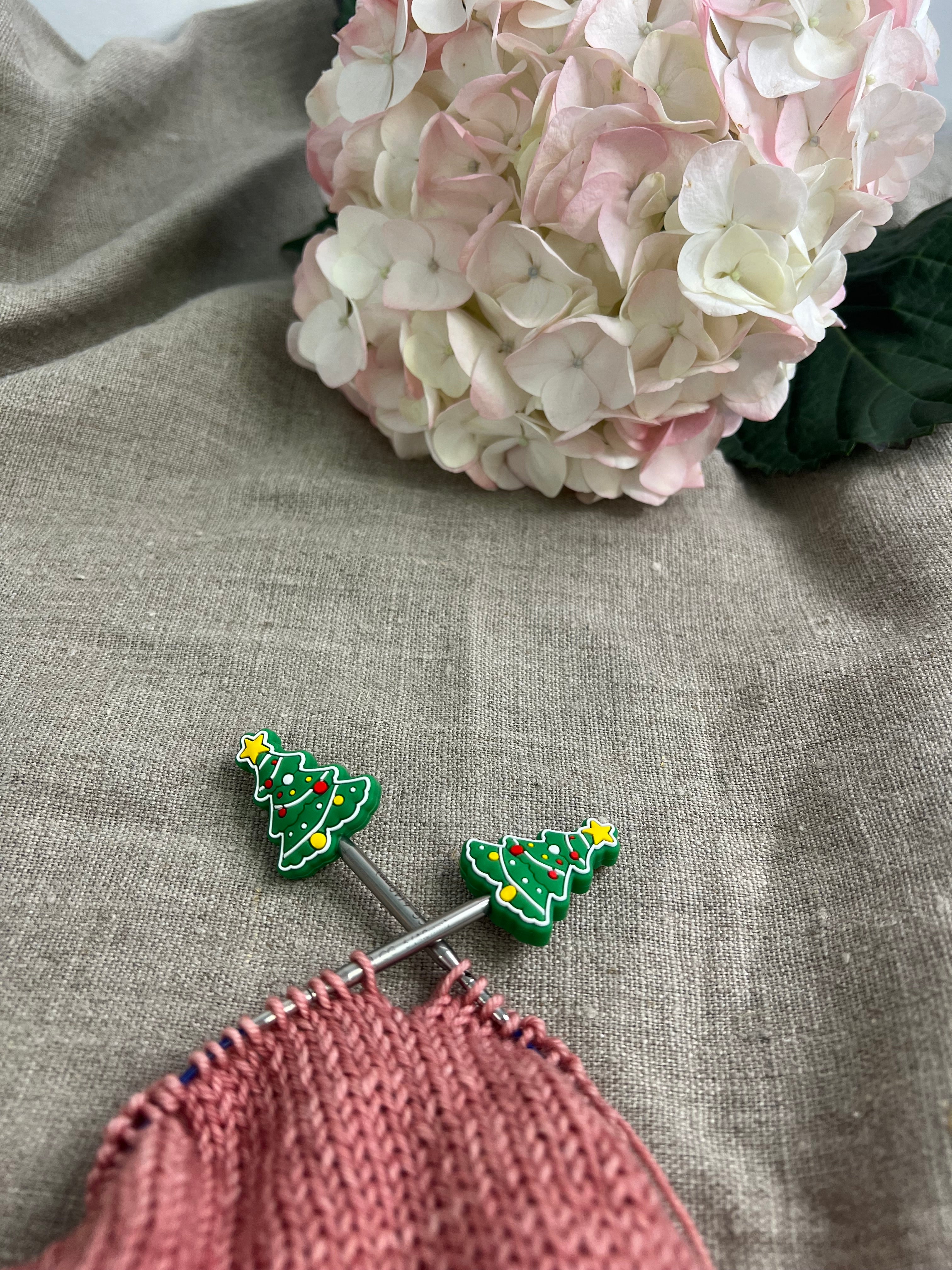 Knitting needle stitch stoppers
